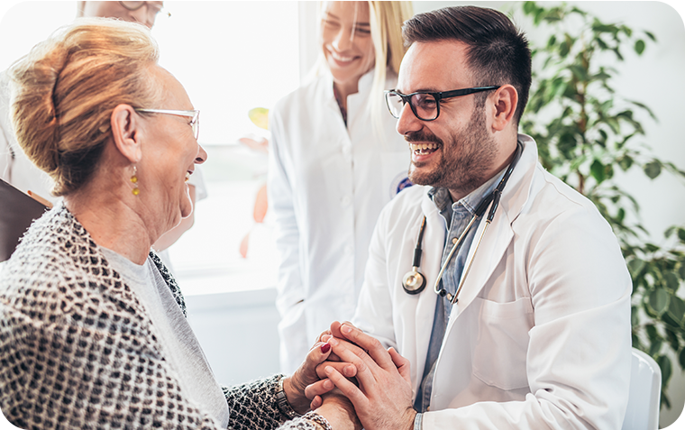 Doctor smiling at elderly woman