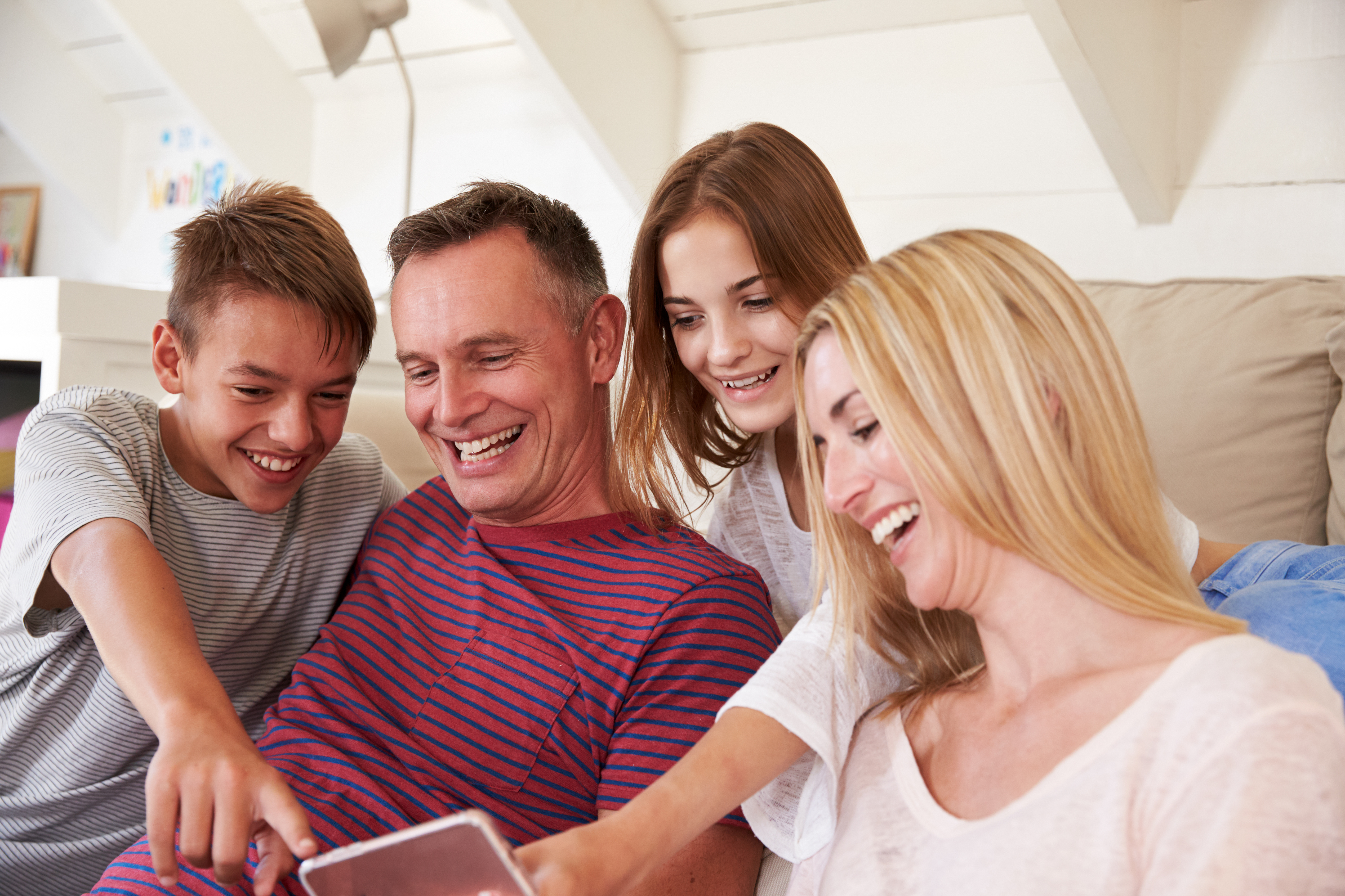 Family on couch reading