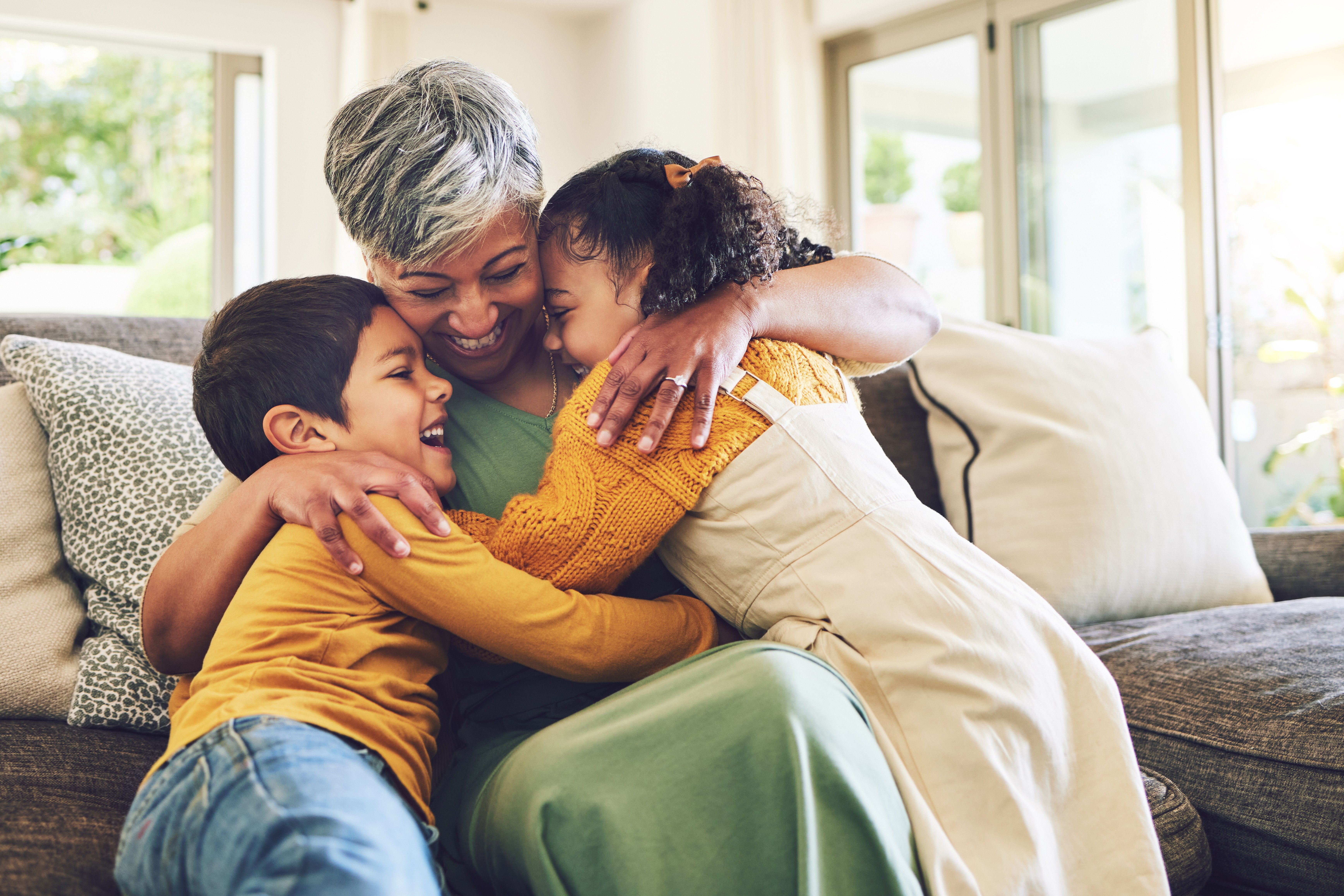 Grandma hugging grandchildren