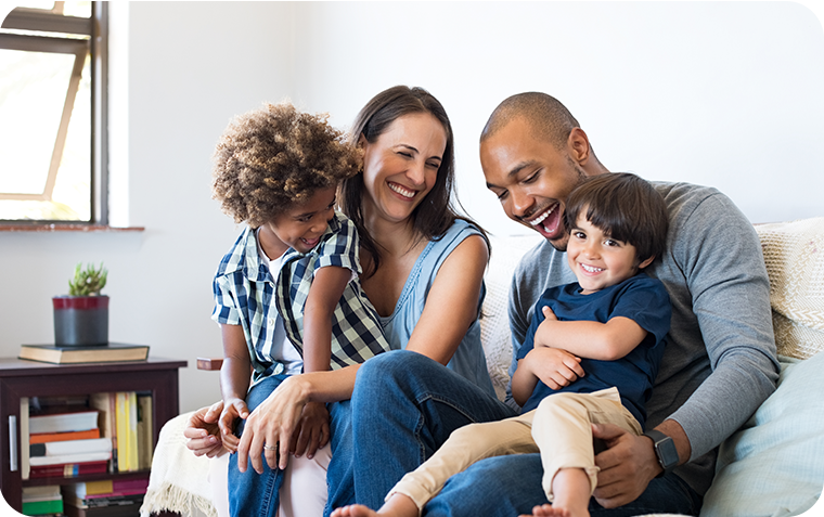 Young parents and young children on couch