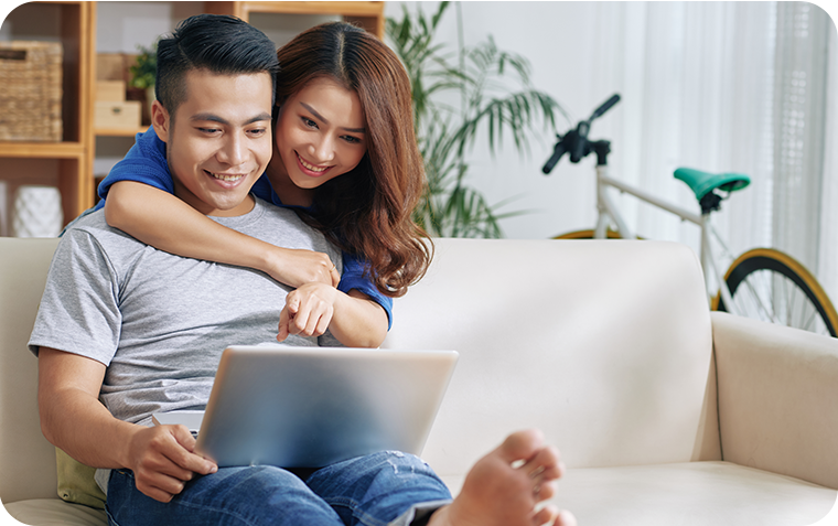 Young asian couple on couch