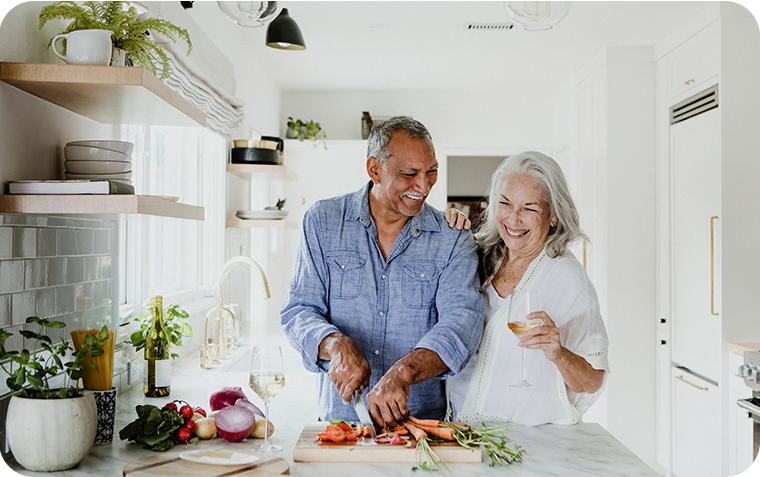 Older couple in kitchen cooking