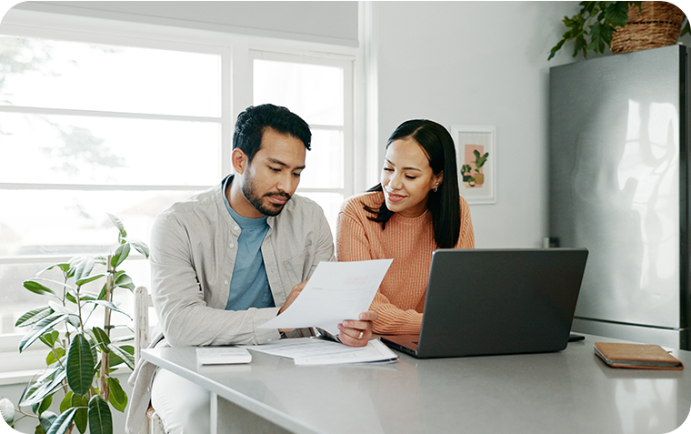 Young couple reviewing paperwork