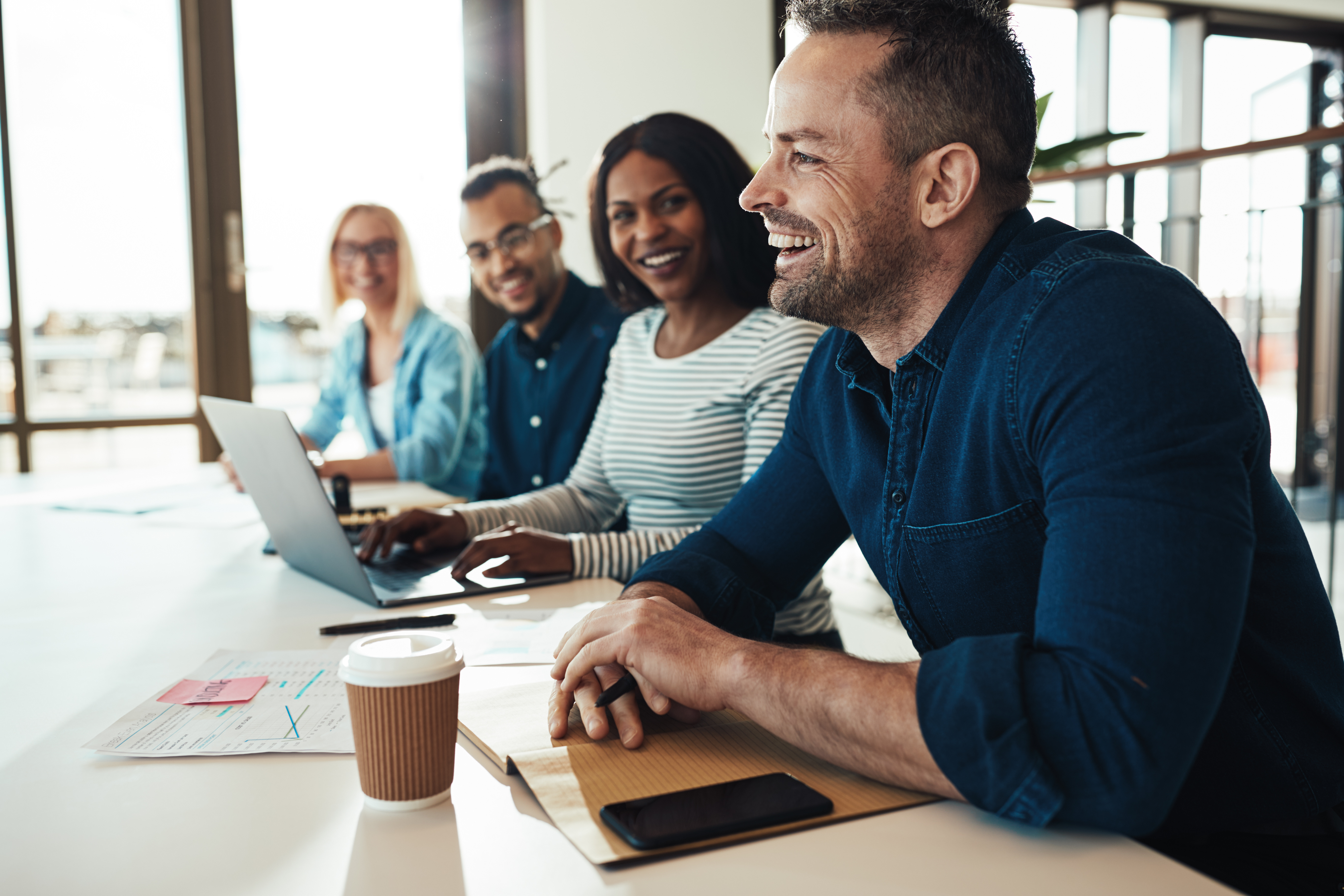 People sitting in an office chatting