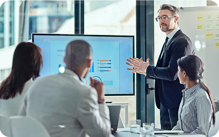 Executive speaking to team in office